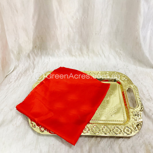 Gold tray with red cloth